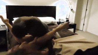 Hubby films his wife with black bull