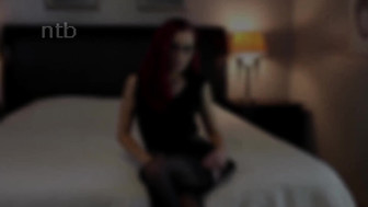 Sexy redhead in glasses