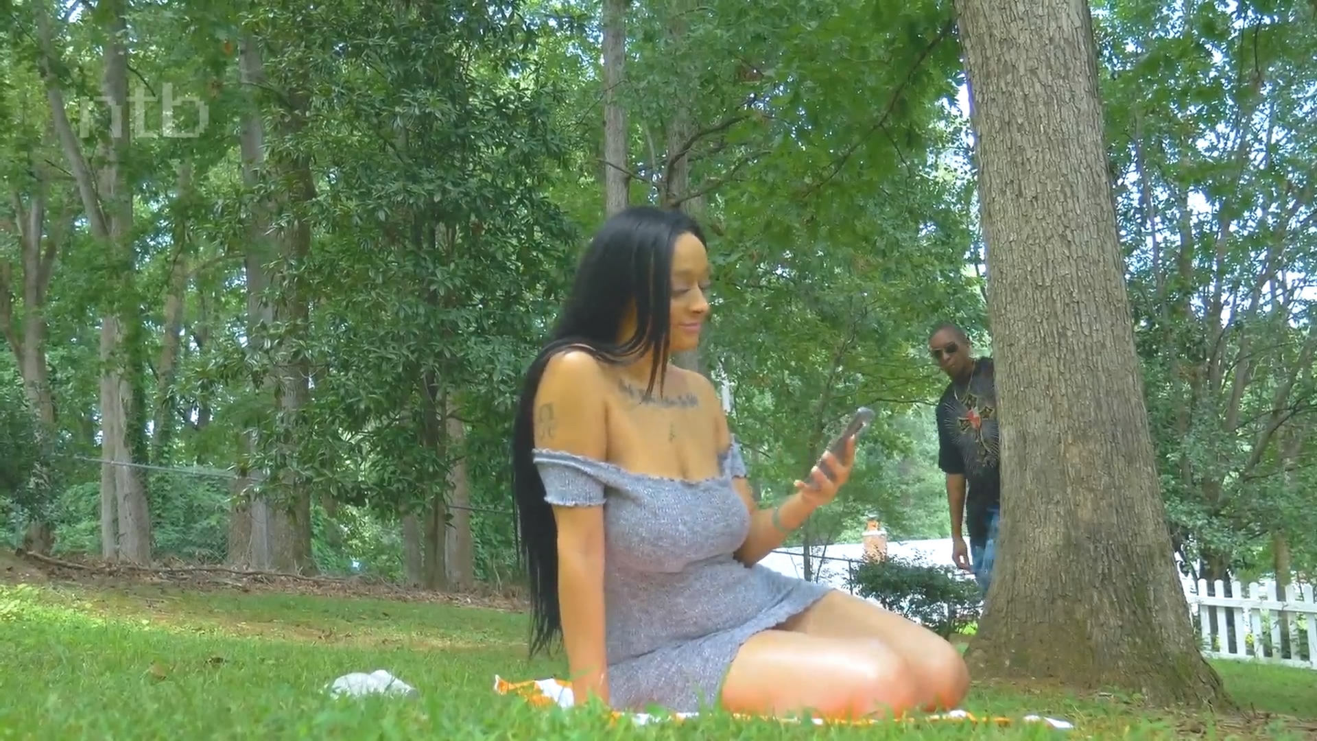 Busty girl and black guy in the park