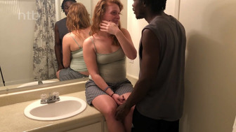 Redhead girl anf her black bf in the bathroom