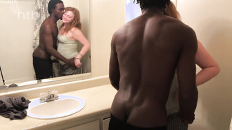 Redhead girl anf her black bf in the bathroom