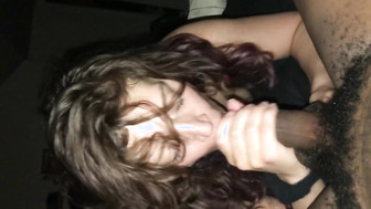 Hot brunette blowing on a thick black cock