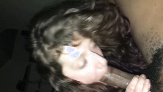 Hot brunette blowing on a thick black cock