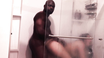 Sexy redhead and her hung black stud take a shower and shags a little bit