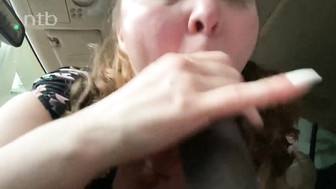 Redhead white MILF sucks that huge black cock while driving his car
