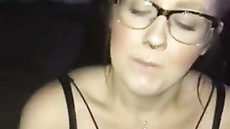 Slut girl in glasses blows black cock