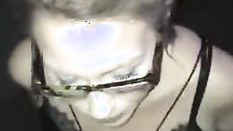 Slut girl in glasses blows black cock