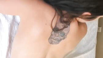 Beautiful girl with tattoo and muscular black bull