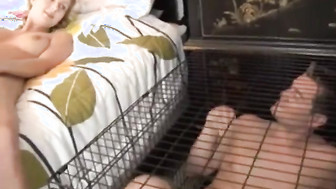 Hubby in a cage watching his wife