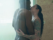 Hot babe with tattoos and a black bull in a hotel room