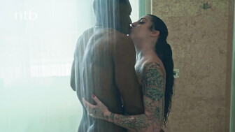 Hot babe with tattoos and a black bull in a hotel room