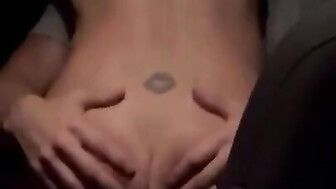 Riding black bull in backseat of car hubby sits in front