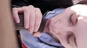 Sucking black cock outside in park