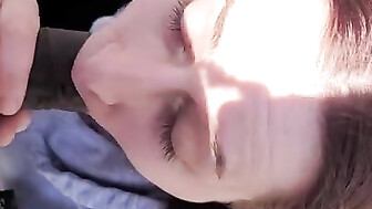 Sucking black cock outside in park