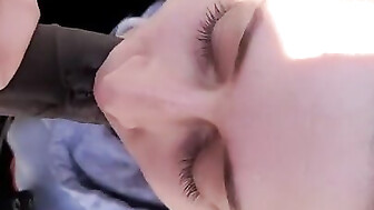 Sucking black cock outside in park