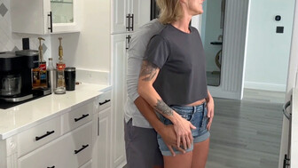 Housewife in the kitchen with a big muscular lover