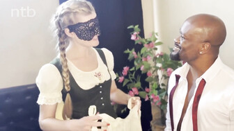 A beautiful blonde in a mask and a strong guy