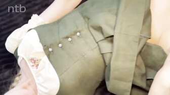 A beautiful blonde in a mask and a strong guy