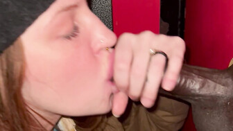 Gloryhole Redhead smiles at thick black cock