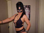 Sexy MILF in black mask worships her black bull