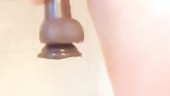 Horny wife Fucks herself with a black dildo